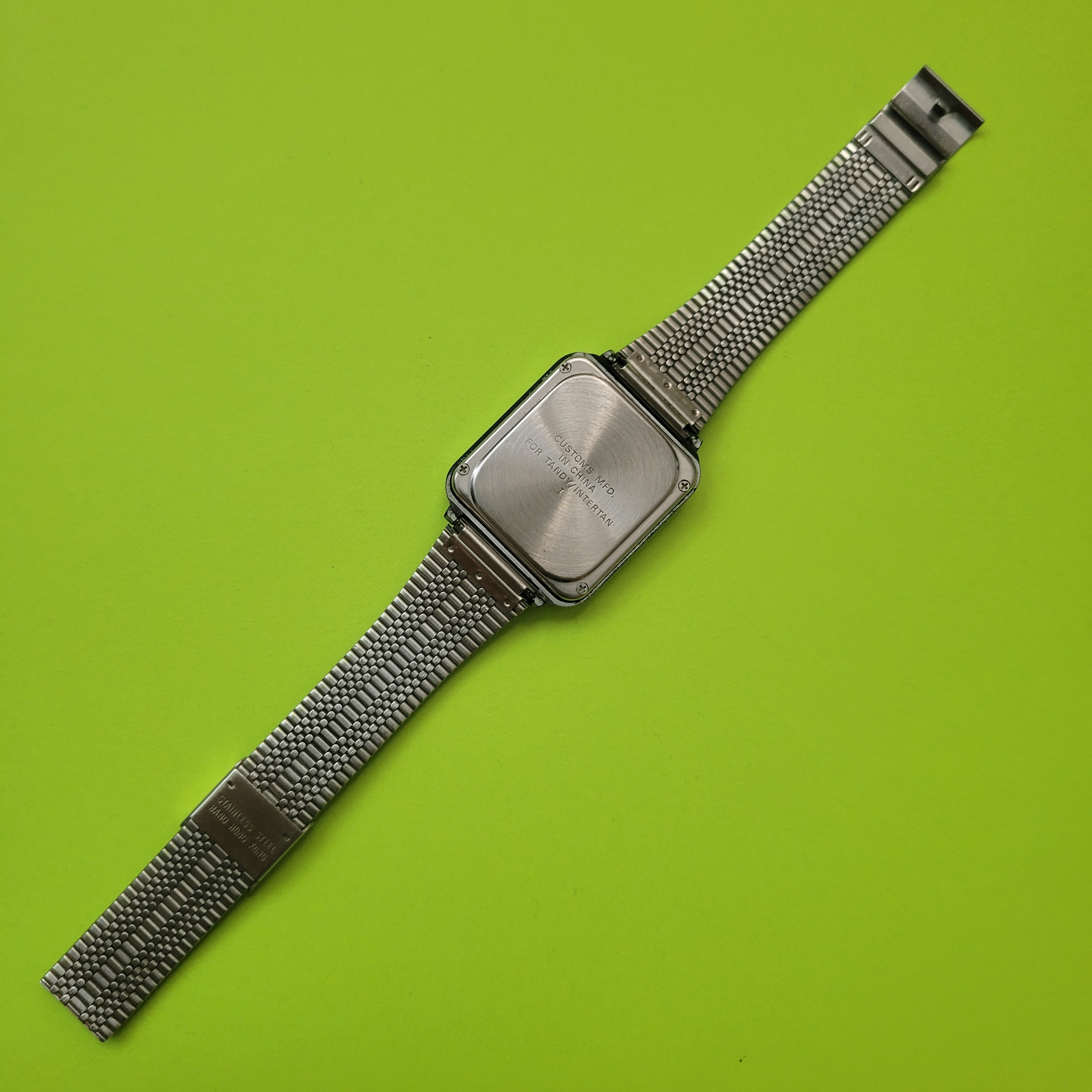 An image of the back of a Micronta calculator watch